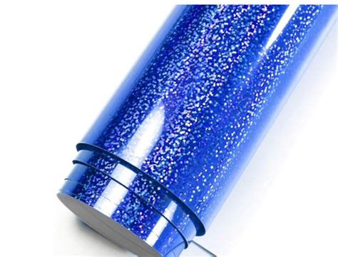 Cricut Holographic Sparkle Iron-On 30X60cm (Blue); 1 roll 12 in. x 24 in. Holographic Sparkle Iron-on; Perfect for custom fashion and accessories, bags, pillows, party and home décor, and more; Cricut® machines cut intricate images through iron-on heat transfer film while leaving the backing intact for easy application